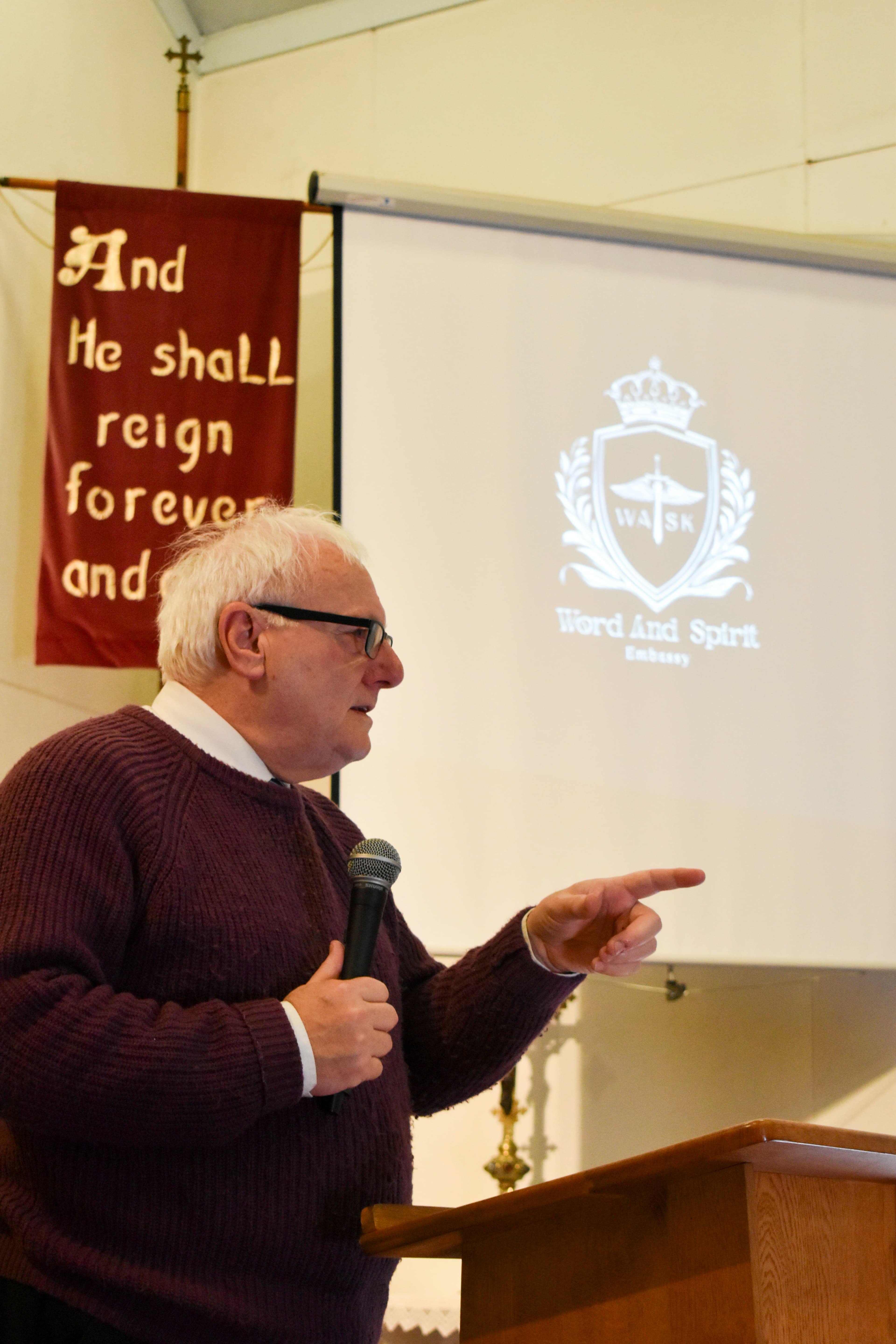preaching message at Word and Spirit Embassy churches in Liverpool during a worship service