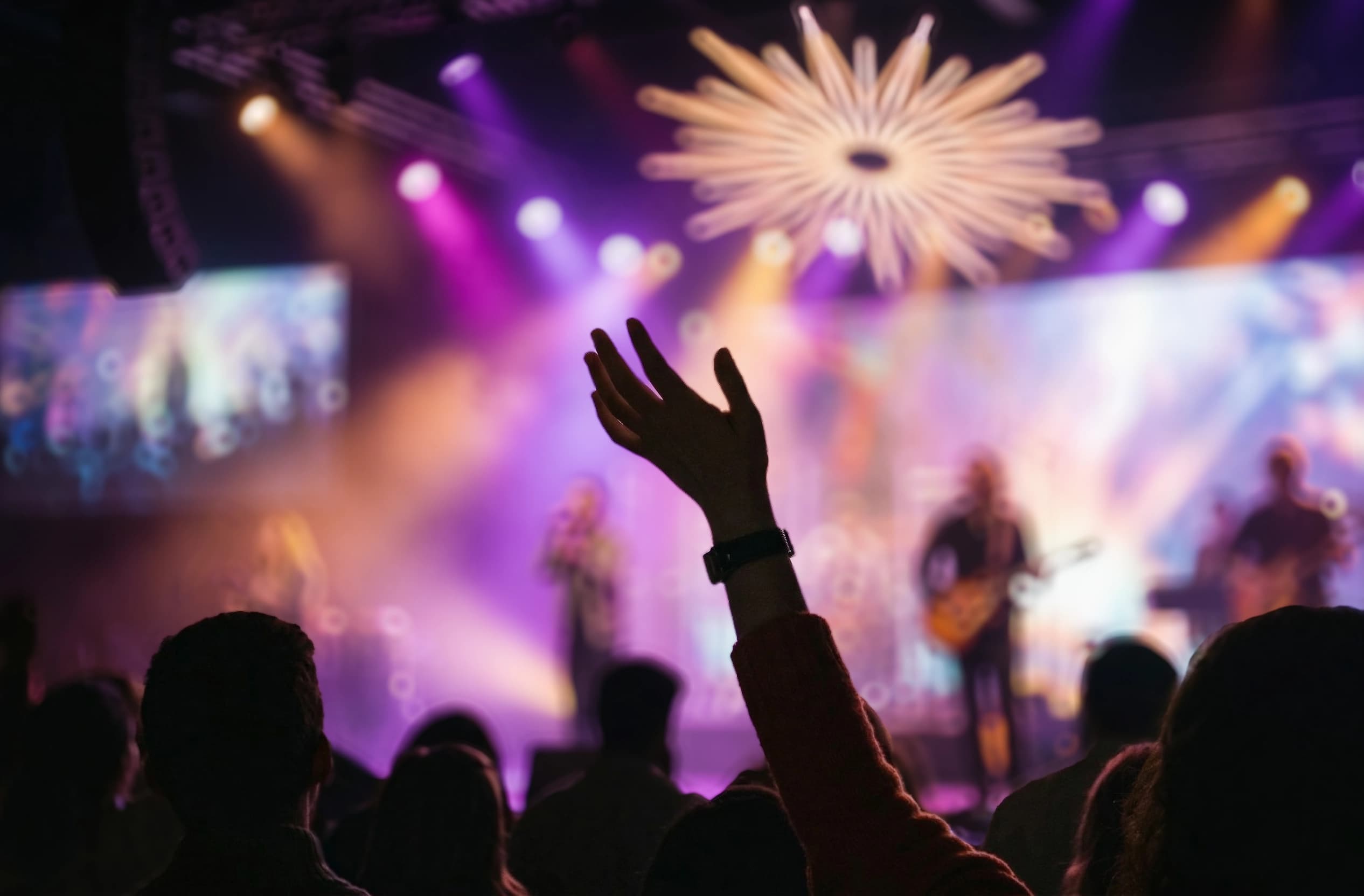 worship gathering raising hands at churches in Liverpool representing a generation rooted in Christ